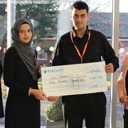 Staff of Barnfield College present a cheque to Luton Foodbank